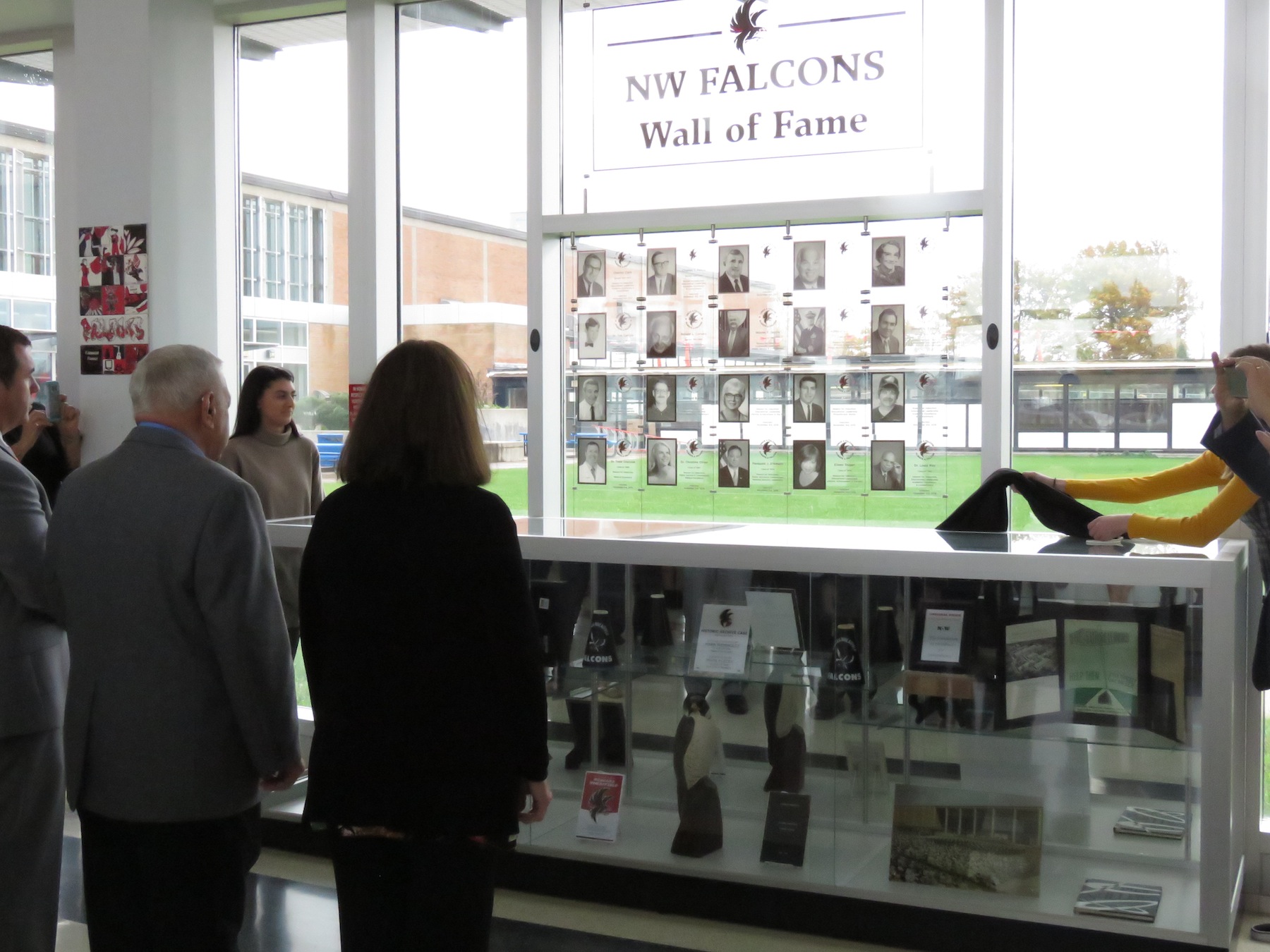 Newly inducted members see their faces on the Falcon Wall of Fame. (Photos by David Yarger)
